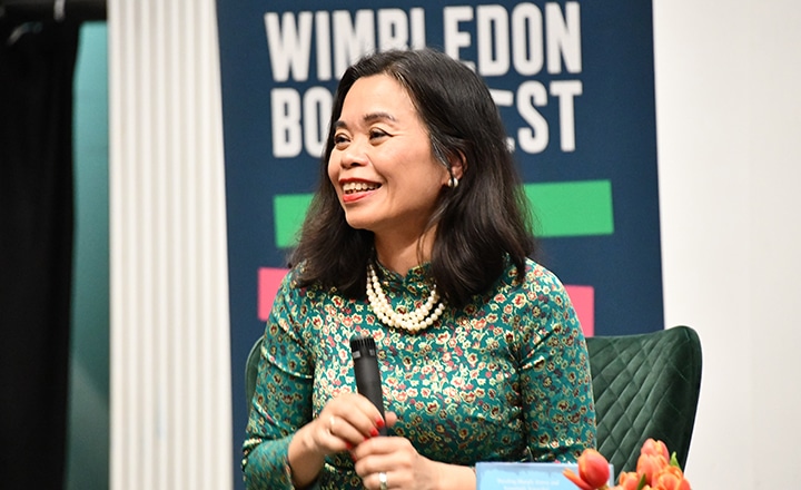 Author Nguyen Phan Que Mai on stage smiling
