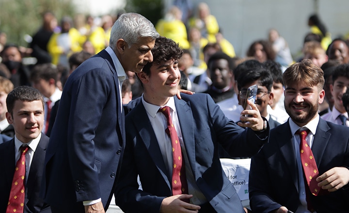 Mayor of London Sadiiq Khan taking selfies with school students