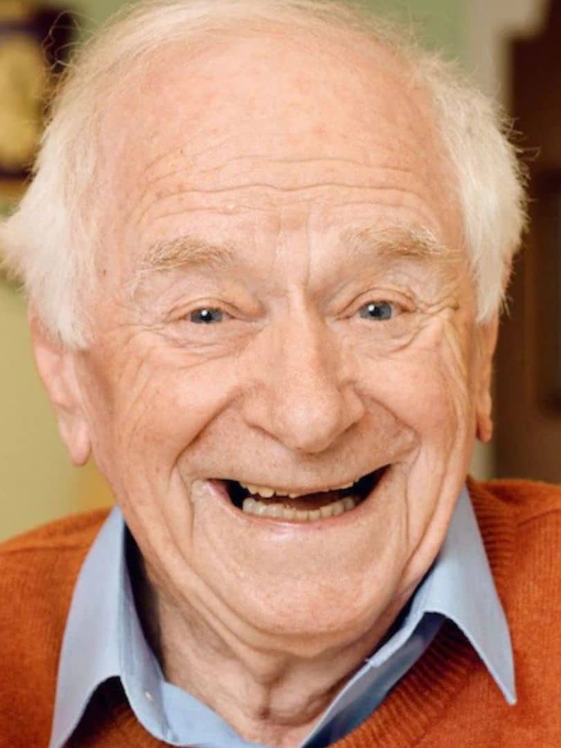 Johnny Ball smiling in a promotional portrait ahead of his appearance at Wimbledon BookFest.